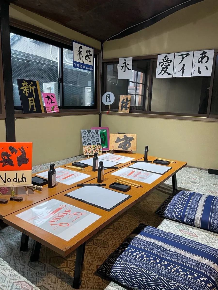 The calligraphy classroom with low tables, brushes and ink set out